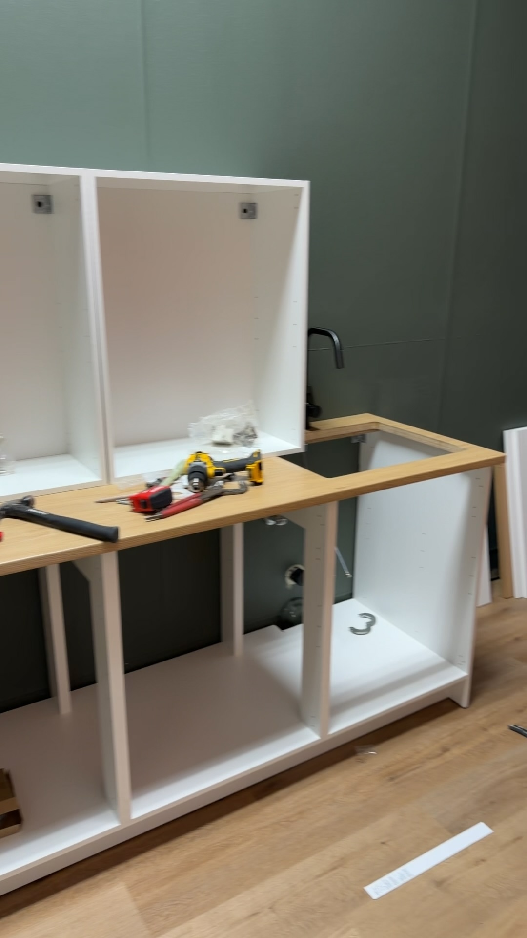 White cabinets and countertop during assembly